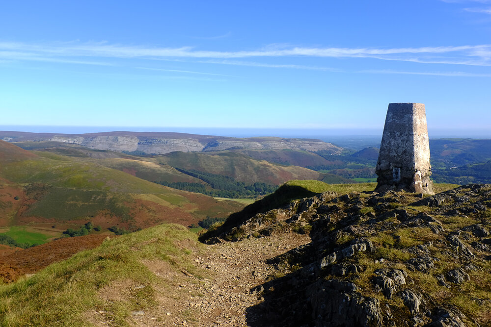 Trig point and summit of Moel Morfydd,  Llantyslio Mountain